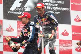 12.07.2009 Nürburg, Germany,  2nd place Sebastian Vettel (GER), Red Bull Racing with 1st place Mark Webber (AUS), Red Bull Racing  - Formula 1 World Championship, Rd 9, German Grand Prix, Sunday Podium