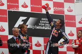 12.07.2009 Nürburg, Germany,  2nd place Sebastian Vettel (GER), Red Bull Racing with 1st place Mark Webber (AUS), Red Bull Racing and 3rd place Felipe Massa (BRA), Scuderia Ferrari - Formula 1 World Championship, Rd 9, German Grand Prix, Sunday Podium