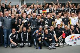 12.07.2009 Nürburg, Germany,  1st place Mark Webber (AUS), Red Bull Racing, Christian Horner (GBR), Red Bull Racing, Sporting Director and Sebastian Vettel (GER), Red Bull Racing celebrate with the team - Formula 1 World Championship, Rd 9, German Grand Prix, Sunday Podium