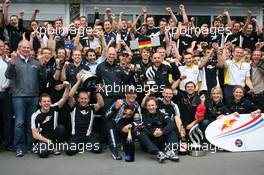 12.07.2009 Nürburg, Germany,  1st place Mark Webber (AUS), Red Bull Racing, Christian Horner (GBR), Red Bull Racing, Sporting Director and Sebastian Vettel (GER), Red Bull Racing celebrate with the team - Formula 1 World Championship, Rd 9, German Grand Prix, Sunday Podium