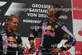 12.07.2009 Nürburg, Germany,  2nd place Sebastian Vettel (GER), Red Bull Racing with 1st place Mark Webber (AUS), Red Bull Racing  - Formula 1 World Championship, Rd 9, German Grand Prix, Sunday Podium