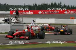 12.07.2009 Nürburg, Germany,  Felipe Massa (BRA), Scuderia Ferrari, Sebastian Vettel (GER), Red Bull Racing, Kimi Raikkonen (FIN), Räikkönen, Scuderia Ferrari - Formula 1 World Championship, Rd 9, German Grand Prix, Sunday Race