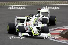12.07.2009 Nürburg, Germany,  Rubens Barrichello (BRA), Brawn GP, BGP001, BGP 001 leads Jenson Button (GBR), Brawn GP, BGP001, BGP 001 - Formula 1 World Championship, Rd 9, German Grand Prix, Sunday Race