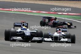 12.07.2009 Nürburg, Germany,  Nico Rosberg (GER), Williams F1 Team, FW31 leads Robert Kubica (POL), BMW Sauber F1 Team, F1.09 - Formula 1 World Championship, Rd 9, German Grand Prix, Sunday Race