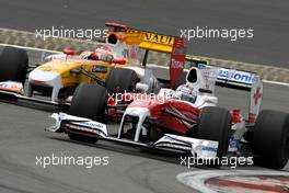 12.07.2009 Nürburg, Germany,  Timo Glock (GER), Toyota F1 Team , TF109 and Fernando Alonso (ESP), Renault F1 Team, R29 - Formula 1 World Championship, Rd 9, German Grand Prix, Sunday Race