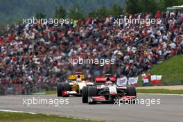 12.07.2009 Nürburg, Germany,  Heikki Kovalainen (FIN), McLaren Mercedes, MP4-24 leads Fernando Alonso (ESP), Renault F1 Team, R29 - Formula 1 World Championship, Rd 9, German Grand Prix, Sunday Race