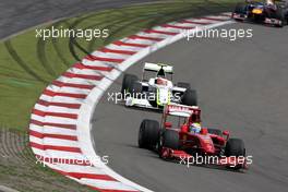 12.07.2009 Nürburg, Germany,  Felipe Massa (BRA), Scuderia Ferrari, F60 leads Rubens Barrichello (BRA), Brawn GP, BGP001, BGP 001- Formula 1 World Championship, Rd 9, German Grand Prix, Sunday Race
