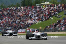 12.07.2009 Nürburg, Germany,  Robert Kubica (POL), BMW Sauber F1 Team, F1.09 leads Nick Heidfeld (GER), BMW Sauber F1 Team, F1.09 - Formula 1 World Championship, Rd 9, German Grand Prix, Sunday Race