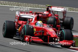 12.07.2009 Nürburg, Germany,  Felipe Massa (BRA), Scuderia Ferrari, F60 leads Kimi Raikkonen (FIN), Räikkönen, Scuderia Ferrari, F60 - Formula 1 World Championship, Rd 9, German Grand Prix, Sunday Race