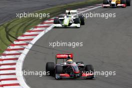 12.07.2009 Nürburg, Germany,  Lewis Hamilton (GBR), McLaren Mercedes, MP4-24 leads Jenson Button (GBR), Brawn GP, BGP001, BGP 001- Formula 1 World Championship, Rd 9, German Grand Prix, Sunday Race