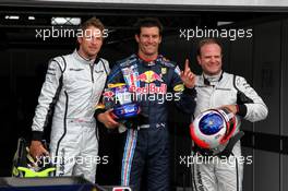 11.07.2009 Nürburg, Germany,  3rd place Jenson Button (GBR), Brawn GP with pole position man Mark Webber and 2nd place Rubens Barrichello (BRA), Brawn GP  (AUS), Red Bull Racing and 3rd pace - Formula 1 World Championship, Rd 9, German Grand Prix, Saturday Qualifying