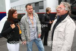 12.07.2009 Nürburg, Germany,  Felix Sturm (GER, middle weight box champion) and his wife talking with Keke Rosberg - Formula 1 World Championship, Rd 9, German Grand Prix, Sunday