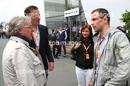 12.07.2009 Nürburg, Germany,  Felix Sturm (GER, middle weight box champion) and his wife talking with Keke Rosberg and Georg Nolte - Formula 1 World Championship, Rd 9, German Grand Prix, Sunday