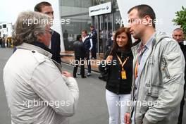 12.07.2009 Nürburg, Germany,  Felix Sturm (GER, middle weight box champion) and his wife talking with Keke Rosberg - Formula 1 World Championship, Rd 9, German Grand Prix, Sunday