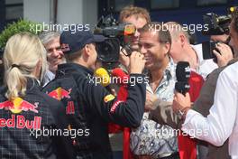 09.07.2009 Nürburg, Germany,  Sebastian Vettel (GER), Red Bull Racing and Kai Ebel (GER), RTL Television - Formula 1 World Championship, Rd 9, German Grand Prix, Thursday