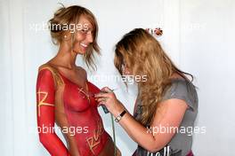 09.07.2009 Nürburg, Germany,  A lady is painted with the Radical sign - Formula 1 World Championship, Rd 9, German Grand Prix, Thursday