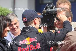 09.07.2009 Nürburg, Germany,  Sebastian Vettel (GER), Red Bull Racing and Kai Ebel (GER), RTL Television - Formula 1 World Championship, Rd 9, German Grand Prix, Thursday