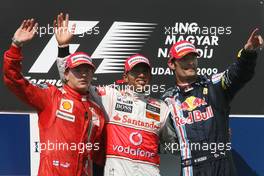26.07.2009 Budapest, Hungary,  Kimi Raikkonen (FIN), Räikkönen, Scuderia Ferrari, Lewis Hamilton (GBR), McLaren Mercedes and Mark Webber (AUS), Red Bull Racing - Formula 1 World Championship, Rd 10, Hungarian Grand Prix, Sunday Podium