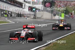 26.07.2009 Budapest, Hungary,  Heikki Kovalainen (FIN), McLaren Mercedes leads Sebastian Vettel (GER), Red Bull Racing - Formula 1 World Championship, Rd 10, Hungarian Grand Prix, Sunday Race