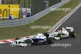 26.07.2009 Budapest, Hungary,  Nick Heidfeld (GER), BMW Sauber F1 Team and Rubens Barrichello (BRA), Brawn GP - Formula 1 World Championship, Rd 10, Hungarian Grand Prix, Sunday Race