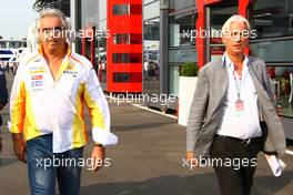 11.09.2009 Monza, Italy,  Flavio Briatore (ITA), Renault F1 and his laywer Ali Malek QC - Formula 1 World Championship, Rd 13, Italian Grand Prix, Friday