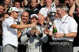 13.09.2009 Monza, Italy,  Jenson Button (GBR), BrawnGP, Rubens Barrichello (BRA), BrawnGP, Ross Brawn (GBR) Team Principal, Brawn GP team celebration - Formula 1 World Championship, Rd 13, Italian Grand Prix, Sunday Podium