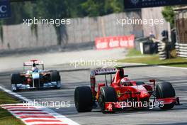 13.09.2009 Monza, Italy,  Kimi Raikkonen (FIN), Räikkönen, Scuderia Ferrari, F60 and Adrian Sutil (GER), Force India F1 Team, VJM-02 - Formula 1 World Championship, Rd 13, Italian Grand Prix, Sunday Race