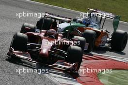 13.09.2009 Monza, Italy,  Kimi Raikkonen (FIN), Räikkönen, Scuderia Ferrari and Adrian Sutil (GER), Force India F1 Team  - Formula 1 World Championship, Rd 13, Italian Grand Prix, Sunday Race