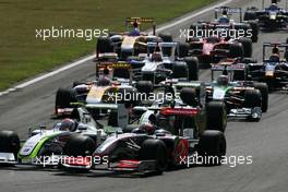 13.09.2009 Monza, Italy,  Start of the race, Heikki Kovalainen (FIN), McLaren Mercedes and Jenson Button (GBR), Brawn GP  - Formula 1 World Championship, Rd 13, Italian Grand Prix, Sunday Race
