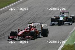 13.09.2009 Monza, Italy,  Kimi Raikkonen (FIN), Räikkönen, Scuderia Ferrari and Adrian Sutil (GER), Force India F1 Team  - Formula 1 World Championship, Rd 13, Italian Grand Prix, Sunday Race