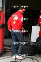 03.03.2009 Jerez, Spain,  Michael Schumacher (GER), Scuderia Ferrari, looking at Bridgestone slick tyres - Formula 1 Testing, Jerez