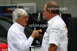 02.10.2009 Suzuka, Japan,  Bernie Ecclestone (GBR), President and CEO of Formula One Management talking with Jean-Francois Caubet (FRA), Managibng director of Renault F1  - Formula 1 World Championship, Rd 15, Japanese Grand Prix, Friday