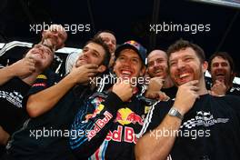 04.10.2009 Suzuka, Japan,  1st place race winner Sebastian Vettel (GER), Red Bull Racing with his bearded team - Formula 1 World Championship, Rd 15, Japanese Grand Prix, Sunday Podium