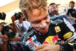 04.10.2009 Suzuka, Japan,  Sebastian Vettel (GER), Red Bull Racing with cake on his face - Formula 1 World Championship, Rd 15, Japanese Grand Prix, Sunday Podium