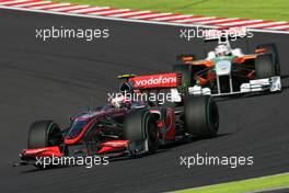 04.10.2009 Suzuka, Japan,  Heikki Kovalainen (FIN), McLaren Mercedes and Adrian Sutil (GER), Force India F1 Team  - Formula 1 World Championship, Rd 15, Japanese Grand Prix, Sunday Race