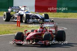 04.10.2009 Suzuka, Japan,  Kimi Raikkonen (FIN), Räikkönen, Scuderia Ferrari leads Nico Rosberg (GER), WilliamsF1 Team - Formula 1 World Championship, Rd 15, Japanese Grand Prix, Sunday Race