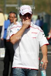 03.10.2009 Suzuka, Japan,  Timo Glock (GER), Toyota F1 Team covers his mouth whilst coughing - Formula 1 World Championship, Rd 15, Japanese Grand Prix, Saturday
