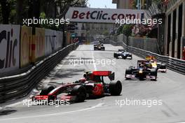 24.05.2009 Monte Carlo, Monaco,  Heikki Kovalainen (FIN), McLaren Mercedes, MP4-24 leads Mark Webber (AUS), Red Bull Racing, RB5 - Formula 1 World Championship, Rd 6, Monaco Grand Prix, Sunday Race