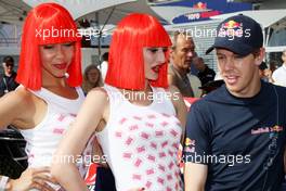 23.05.2009 Monte Carlo, Monaco,  Crazy horse girls and Sebastian Vettel (GER), Red Bull Racing - Formula 1 World Championship, Rd 6, Monaco Grand Prix, Saturday