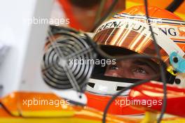 03.04.2009 Kuala Lumpur, Malaysia,  Nelson Piquet Jr (BRA), Renault F1 Team, uses a fan to keep cool - Formula 1 World Championship, Rd 2, Malaysian Grand Prix, Friday Practice