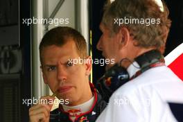 03.04.2009 Kuala Lumpur, Malaysia,  Sebastian Vettel (GER), Red Bull Racing and Helmut Marko (AUT), Red Bull Racing, Red Bull Advisor - Formula 1 World Championship, Rd 2, Malaysian Grand Prix, Friday Practice
