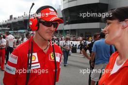 05.04.2009 Kuala Lumpur, Malaysia,  Michael Schumacher (GER), Test Driver, Scuderia Ferrari and  Tanja Bauer (Premiere TV) - Formula 1 World Championship, Rd 2, Malaysian Grand Prix, Sunday Pre-Race Grid