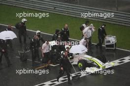 05.04.2009 Kuala Lumpur, Malaysia,  Jenson Button (GBR), Brawn GP crosses the line to win the race, after the race is red flagged due to rain - Formula 1 World Championship, Rd 2, Malaysian Grand Prix, Sunday Race