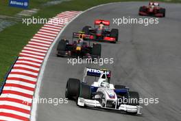 05.04.2009 Kuala Lumpur, Malaysia,  Nick Heidfeld (GER), BMW Sauber F1 Team, F1.09 leads Sebastian Vettel (GER), Red Bull Racing, RB5 - Formula 1 World Championship, Rd 2, Malaysian Grand Prix, Sunday Race