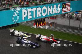 05.04.2009 Kuala Lumpur, Malaysia,  Race stopped due to rain and the cars form up on the grid, Nico Rosberg (GER), Williams F1 Team, FW31, Jarno Trulli (ITA), Toyota Racing, TF109 - Formula 1 World Championship, Rd 2, Malaysian Grand Prix, Sunday Race