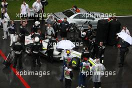 05.04.2009 Kuala Lumpur, Malaysia,  Jenson Button (GBR), Brawn GP, on the reformed grid, after the race was red flagged due to rain - Formula 1 World Championship, Rd 2, Malaysian Grand Prix, Sunday Race