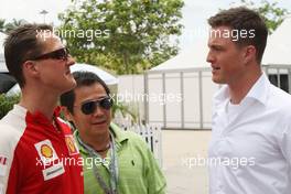 04.04.2009 Kuala Lumpur, Malaysia,  Michael Schumacher (GER), Scuderia Ferrari with his brother Ralf Schumacher (GER), DTM driver - Formula 1 World Championship, Rd 2, Malaysian Grand Prix, Saturday