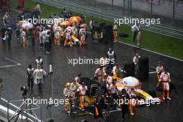 05.04.2009 Kuala Lumpur, Malaysia,  Fernando Alonso (ESP), Renault F1 Team, Nelson Piquet Jr (BRA), Renault F1 Team, after the race was red flagged due to rain - Formula 1 World Championship, Rd 2, Malaysian Grand Prix, Sunday