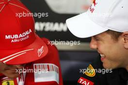 02.04.2009 Kuala Lumpur, Malaysia,  Kimi Raikkonen (FIN), Räikkönen, Scuderia Ferrari, Sebastian Vettel (GER), Red Bull Racing - Formula 1 World Championship, Rd 2, Malaysian Grand Prix, Thursday Press Conference