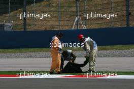 05.06.2009 Istanbul, Turkey,  Marshall's take away fake grass from the side of the track after it came loose causing the sesion to be red flagged - Formula 1 World Championship, Rd 7, Turkish Grand Prix, Friday Practice
